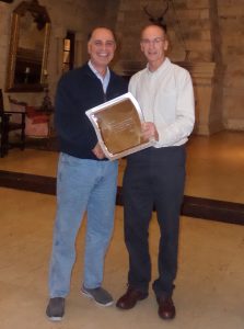 Michael South (left) receiving long service award from Khosro Khodayari